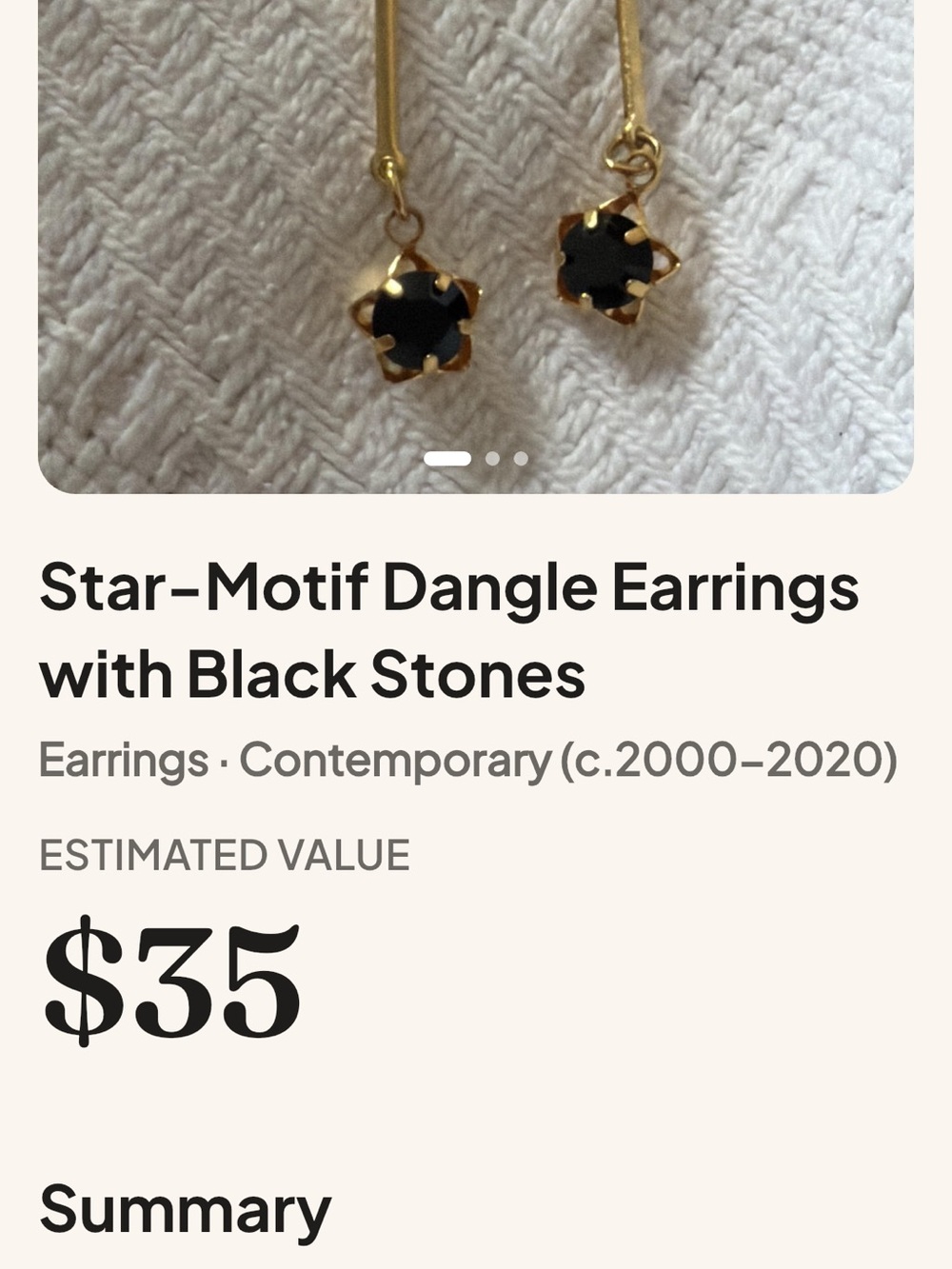 Gold Star-Motif Dangle Earrings with Black Stones